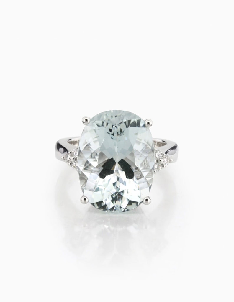 18ct white gold cocktail ring with a large oval aquamarine and diamond-set shoulders