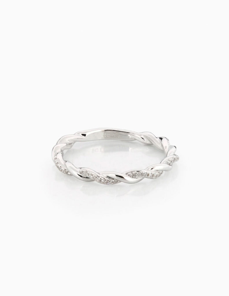 Diamond twist ring with two interwoven strands, one plain and one pave-set with diamonds, in white gold