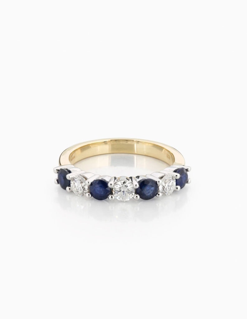 18ct yellow gold half-eternity ring set with alternating blue sapphires and round diamonds