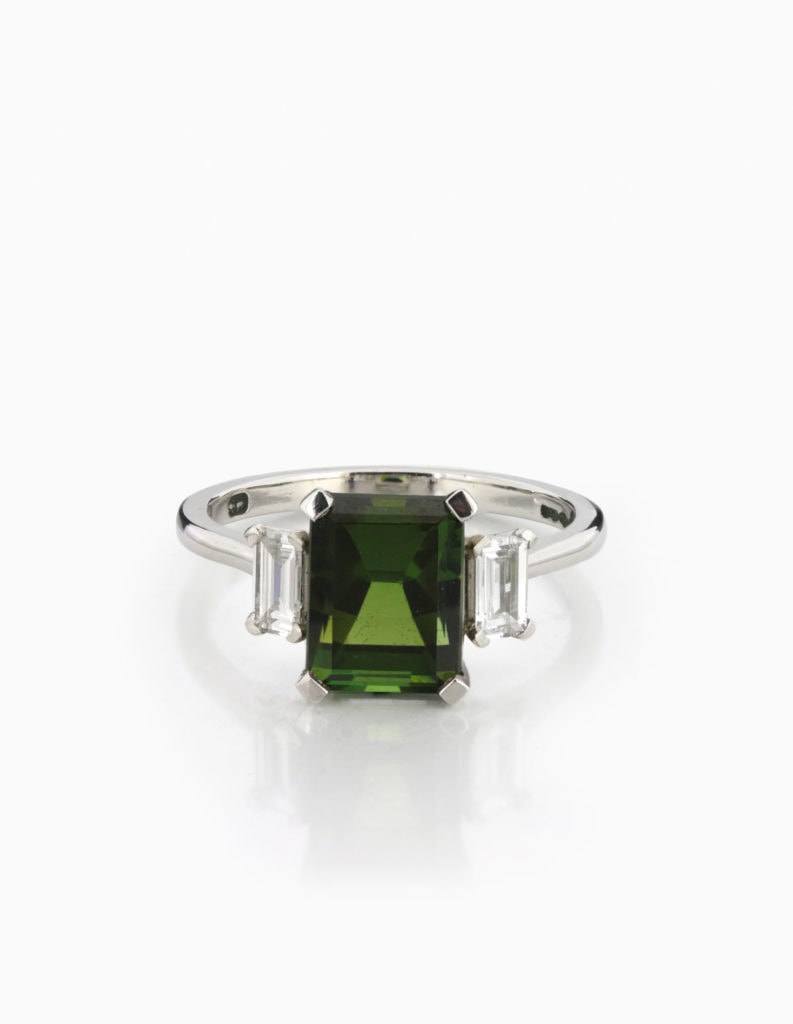 18ct white gold three-stone ring with an emerald-cut green tourmaline flanked by emerald-cut diamonds