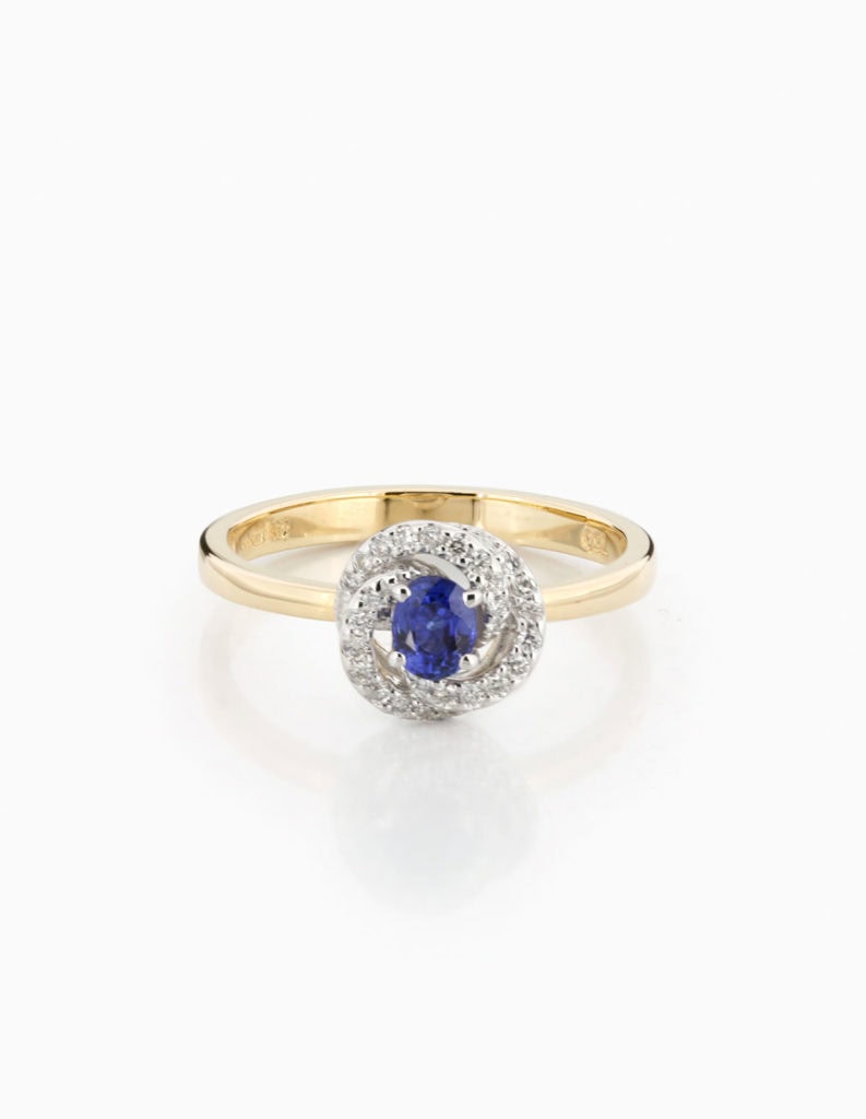 18ct yellow gold dress ring with a central blue sapphire encircled by a swirl of diamonds