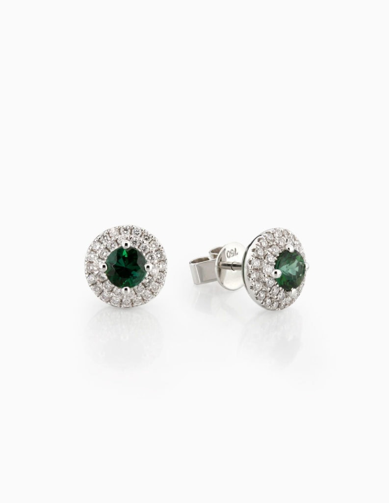 Pair of 18ct white gold stud earrings with round green tourmalines framed by a double diamond halo, shown with the post and butterfly back
