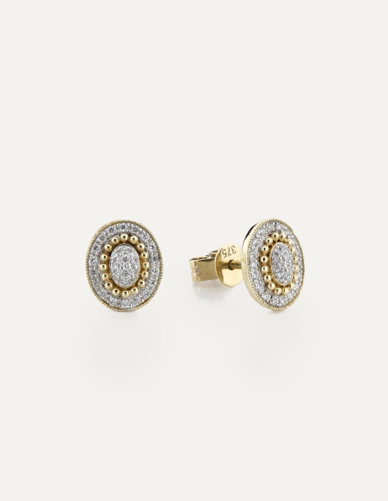 Pair of 9ct two-tone gold vintage-style oval stud earrings pave-set with diamonds and beaded edging, shown with the post and butterfly back