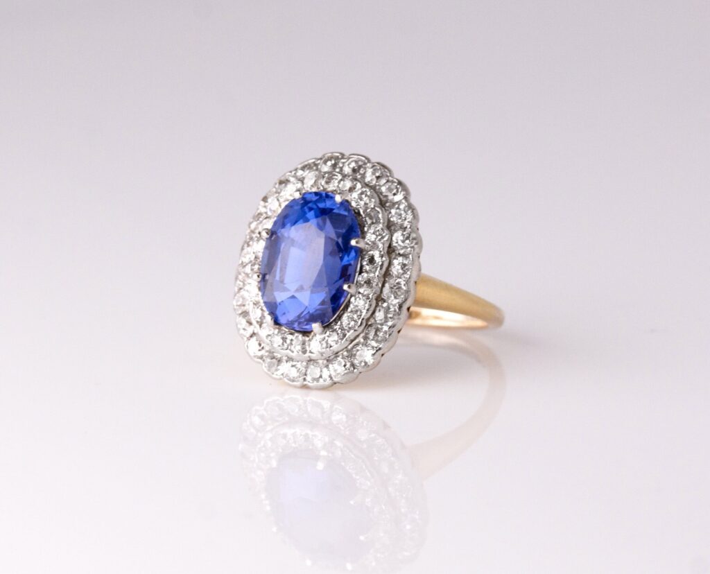 Dress ring oval colour change sapphire 4.29ct with double diamond halo 1.70ct 18ct yellow gold ring size J — side view