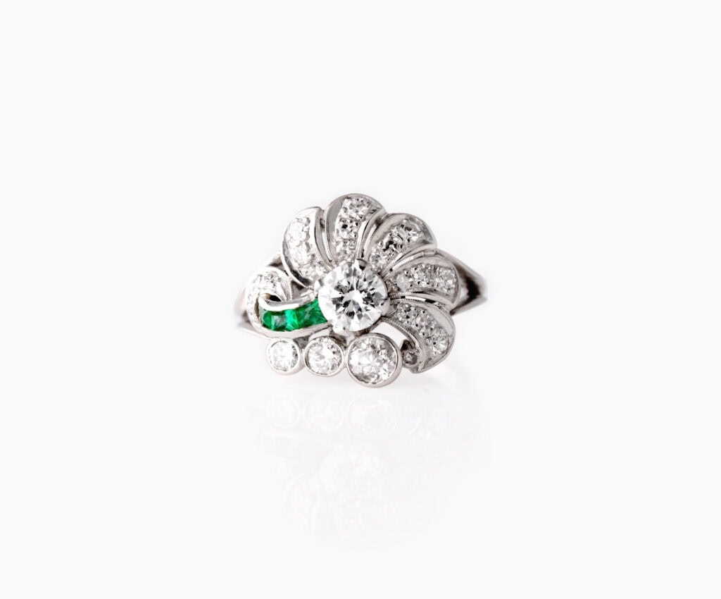 Dress ring fan design with round centre diamond 0.50ct other diamond details 0.76ct with smal emeralds 0.15ct platinum ring size N