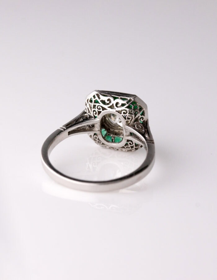 Dress ring art deco style centre roud diamond 1.30ct surrounded by Emeralds 0.90ct Platinum ring size O — back view