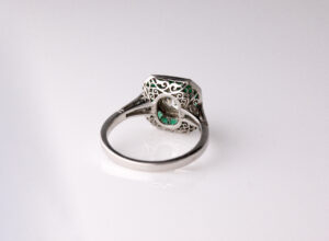 Dress ring art deco style centre roud diamond 1.30ct surrounded by Emeralds 0.90ct Platinum ring size O — back view