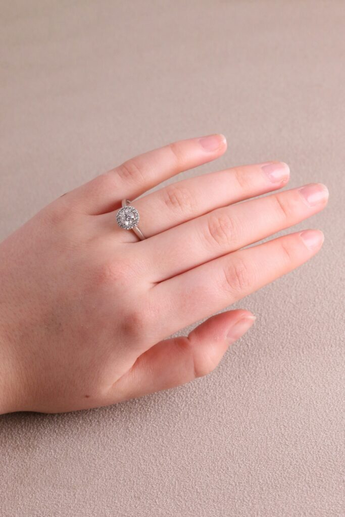 Halo round diamond ring centre four claw 0.62ct G/H SI halo 0.20ct platinum ring size N