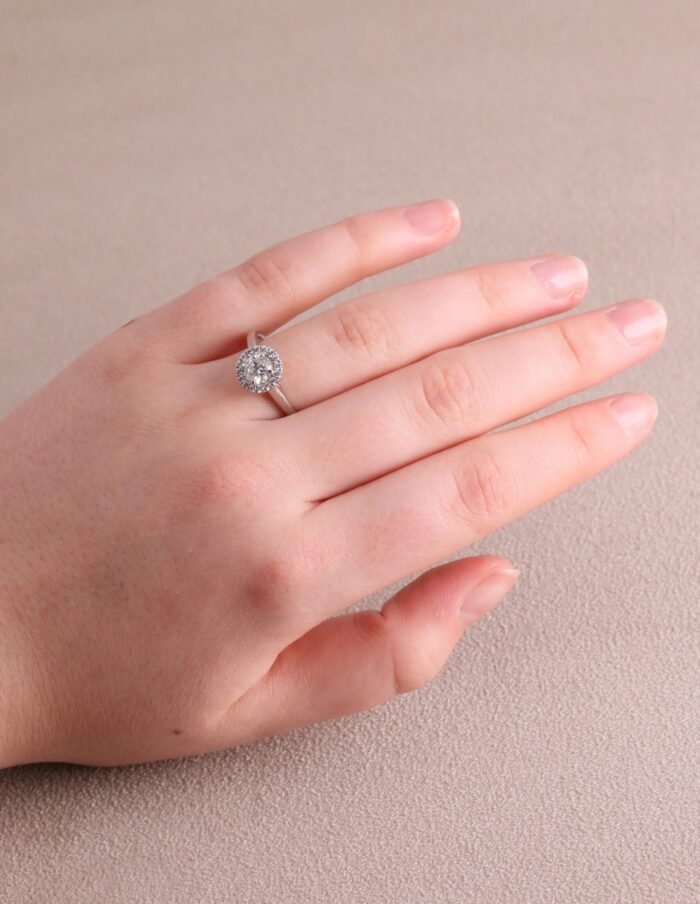 Halo round diamond ring centre four claw 0.62ct G/H SI halo 0.20ct platinum ring size N