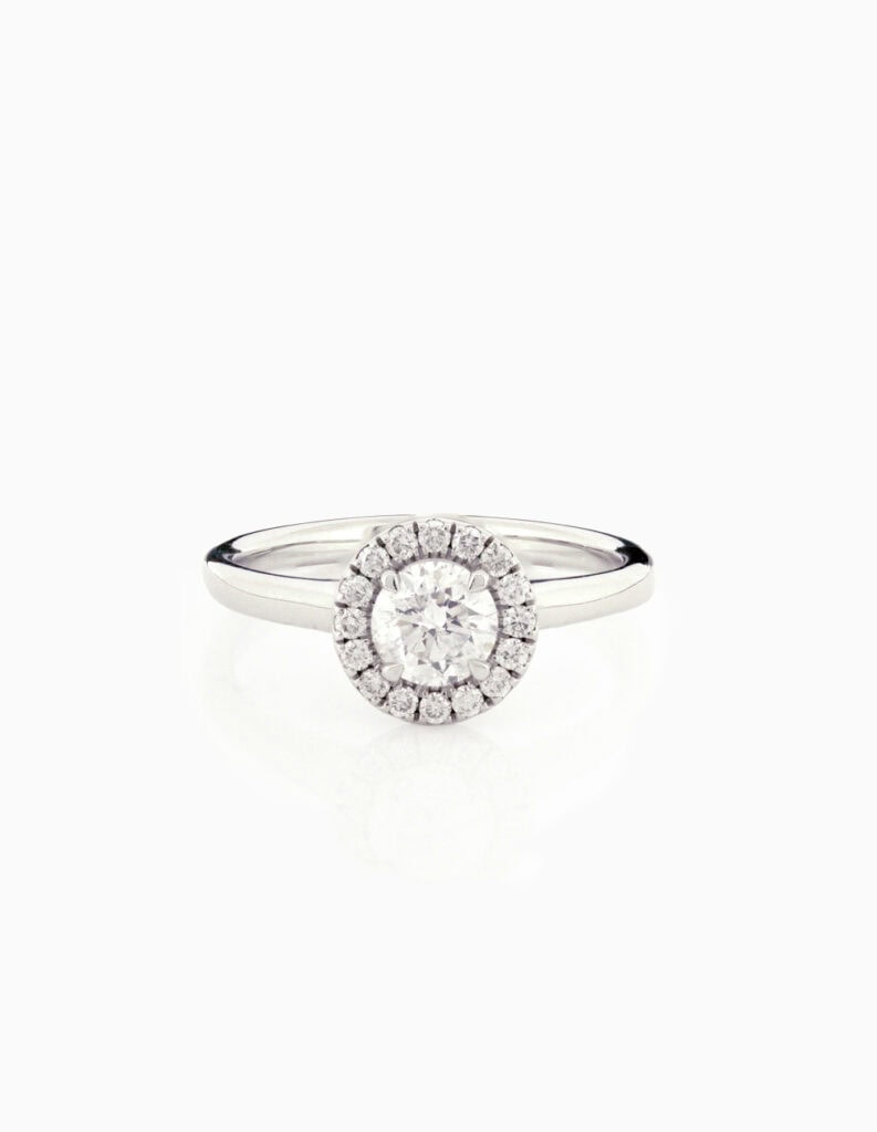 Halo round diamond ring centre four claw 0.62ct G/H SI halo 0.20ct platinum ring size N