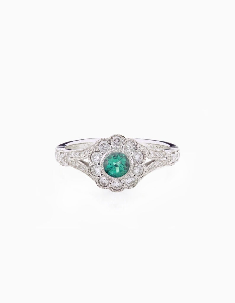 Cluster ring vintage style with emerald centre 0.36ct and diamond surround and shoulders 0.47ct 18ct white gold ring size M