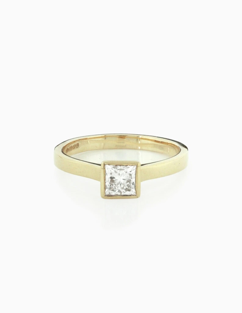 JCP Solitaire rubover princess cut diamond 0.57ct G/VS2 18ct yellow gold ring size M GIA certificate no 6177031331