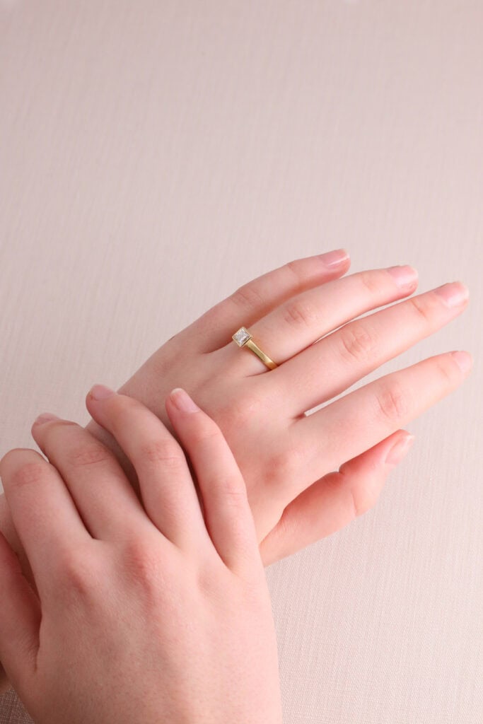 JCP Solitaire rubover princess cut diamond 0.57ct G/VS2 18ct yellow gold ring size M GIA certificate no 6177031331