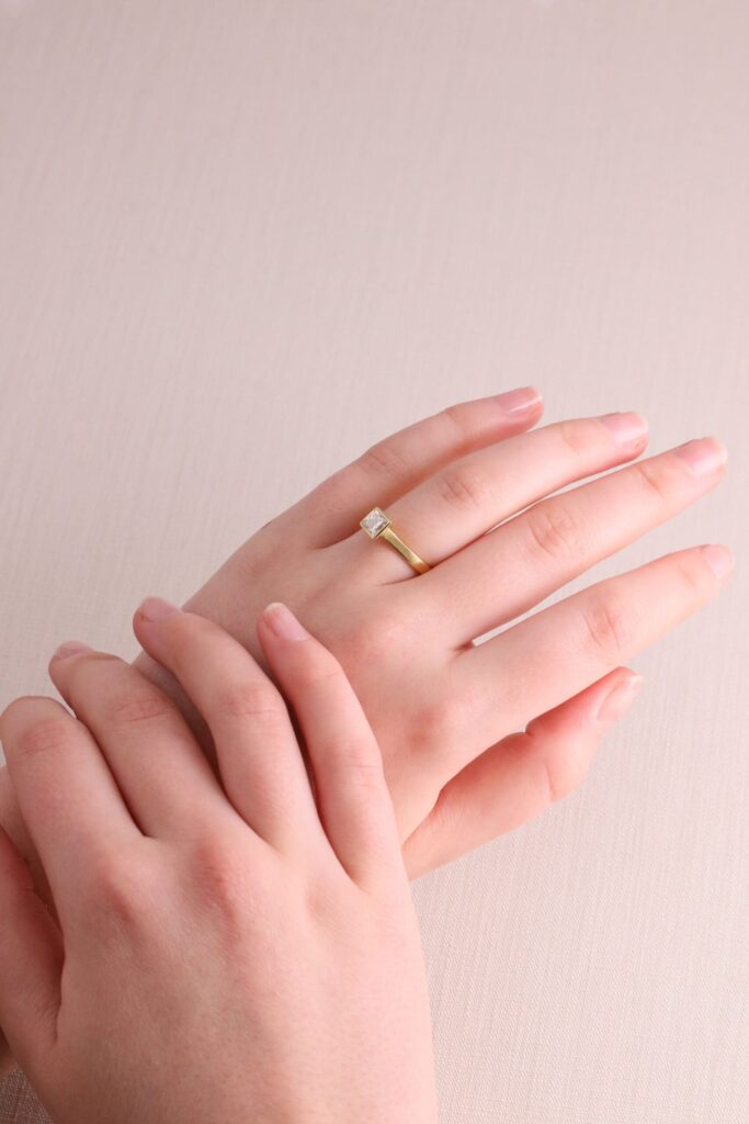 JCP Solitaire rubover princess cut diamond 0.57ct G/VS2 18ct yellow gold ring size M GIA certificate no 6177031331