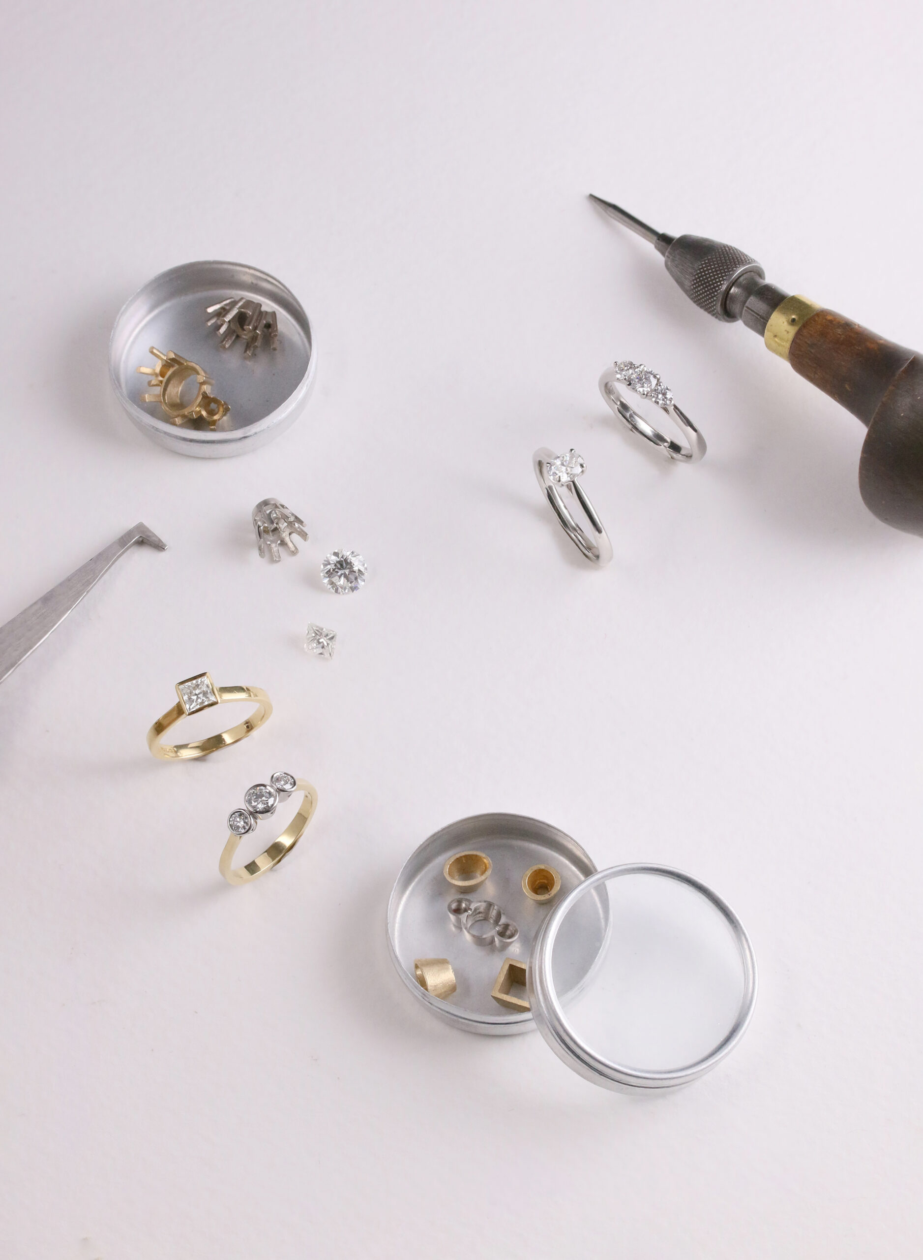 Diamond Engagement Rings surrounded by jewellery tools