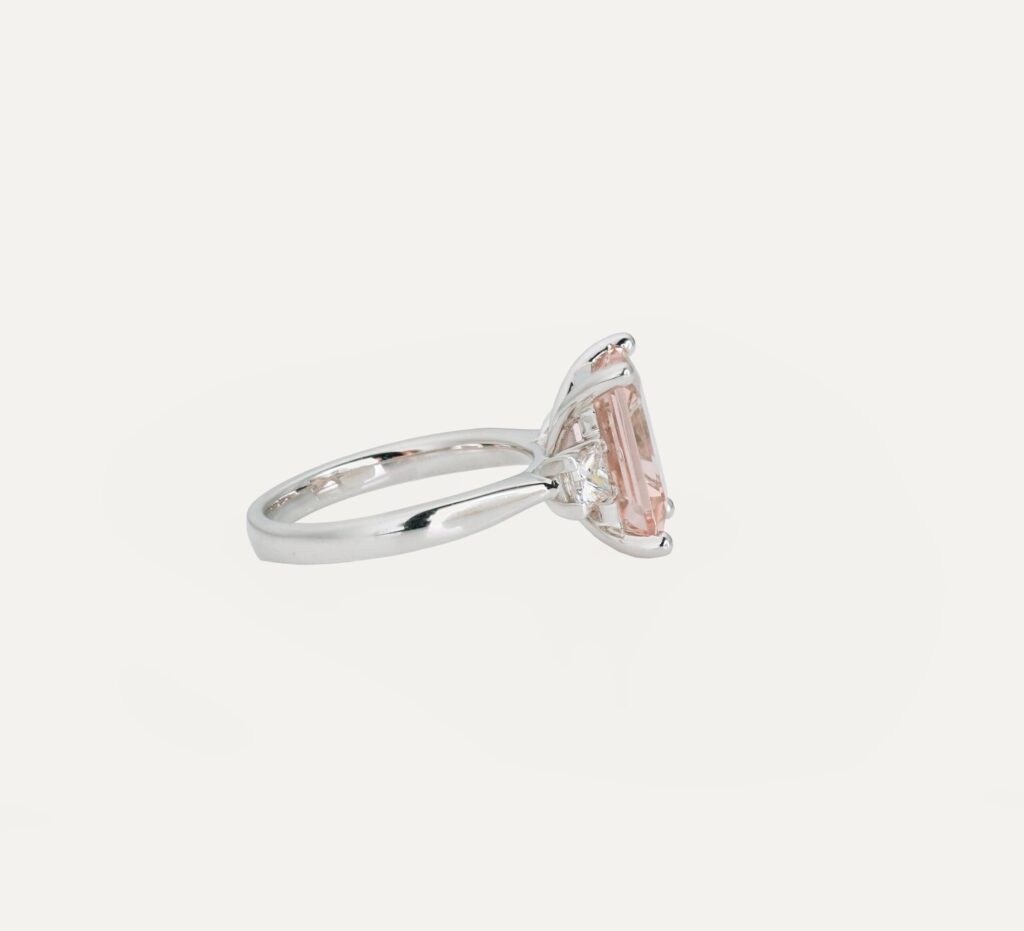 Dress ring octagonal Morganite 3.84ct 4 claw with princess diamonds on shoulders 0.50ct 18ct white gold ring size M — side view
