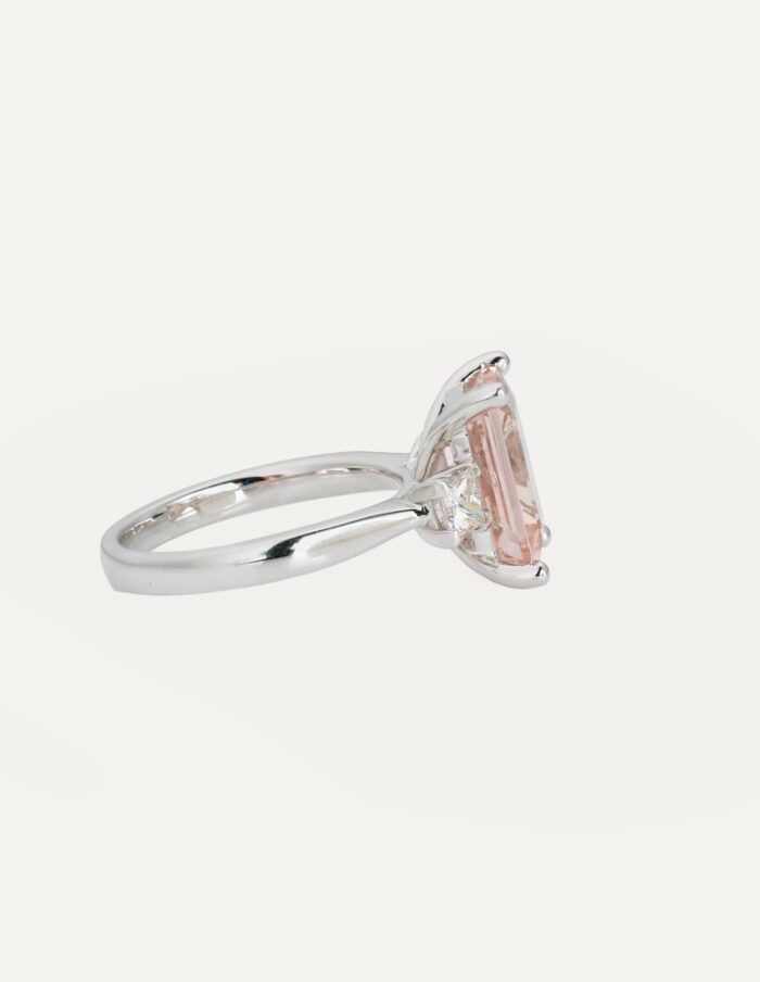 Dress ring octagonal Morganite 3.84ct 4 claw with princess diamonds on shoulders 0.50ct 18ct white gold ring size M — side view