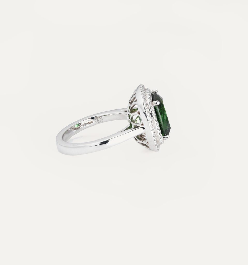 Dress ring green Tourmaline 5.83ct with double halo of round diamonds 0.47ct platinum ring size N — side view