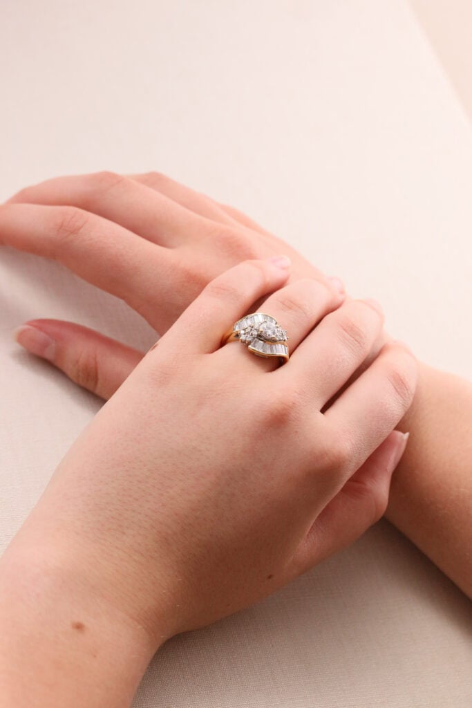 Dress ring tapered baguette and round diamond cross over 18ct yellow gold ring size N