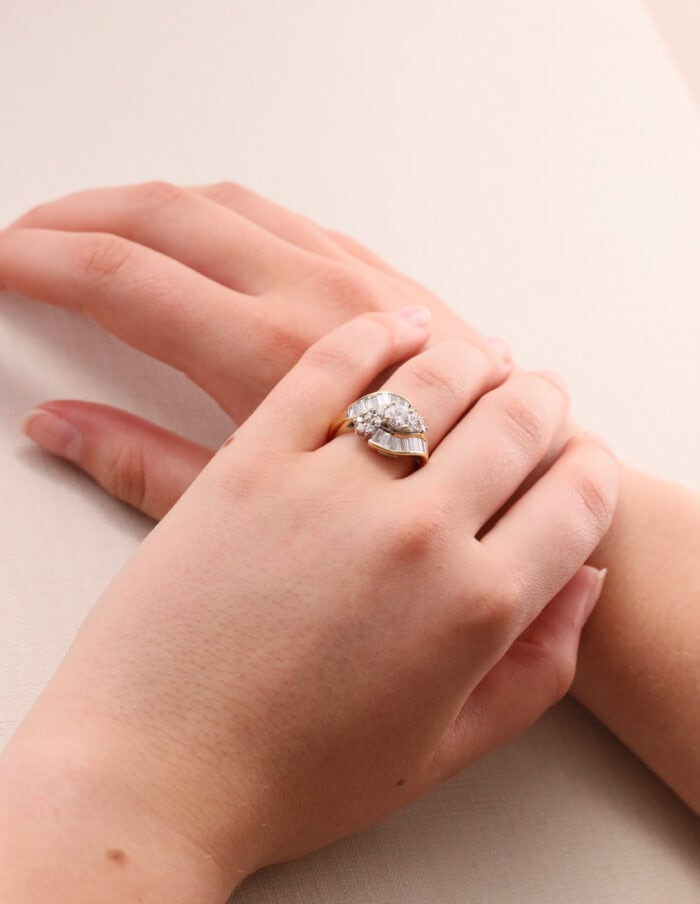 Dress ring tapered baguette and round diamond cross over 18ct yellow gold ring size N