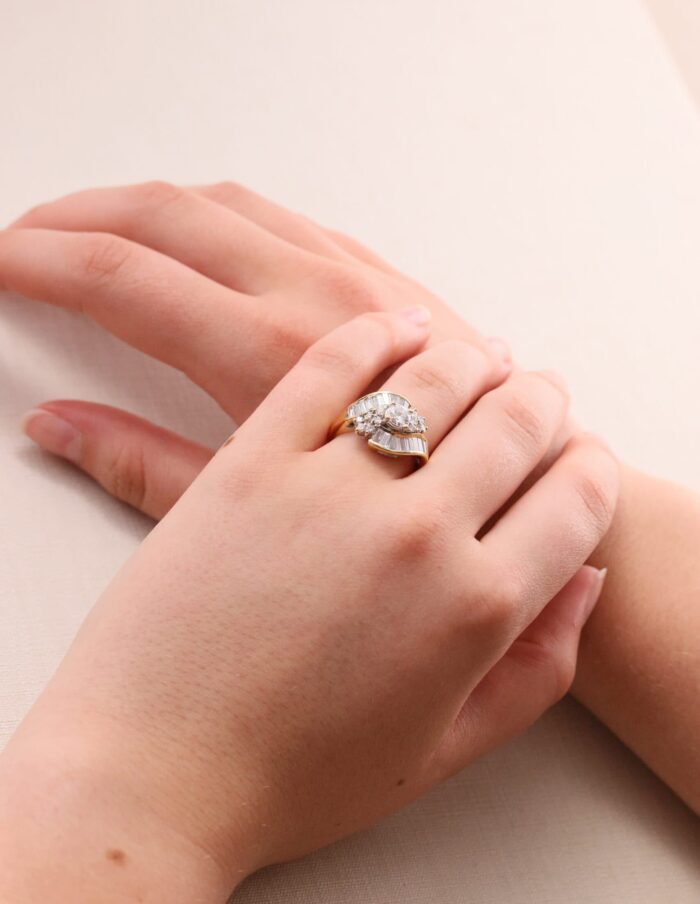 Dress ring tapered baguette and round diamond cross over 18ct yellow gold ring size N