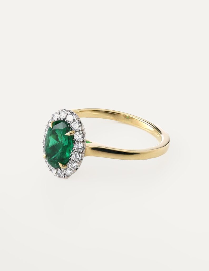 Cluster ring oval Emerald 1.18ct and diamond halo 0.29ct GIA cert 6235634413 18ct yellow gold ring size M — side view
