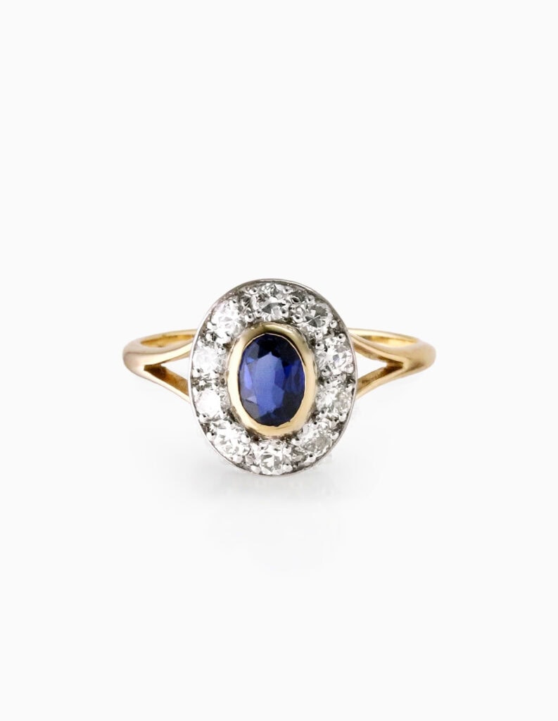 Cluster ring sapphire and diamond 0.60ct 18ct yellow gold ring size T — front view