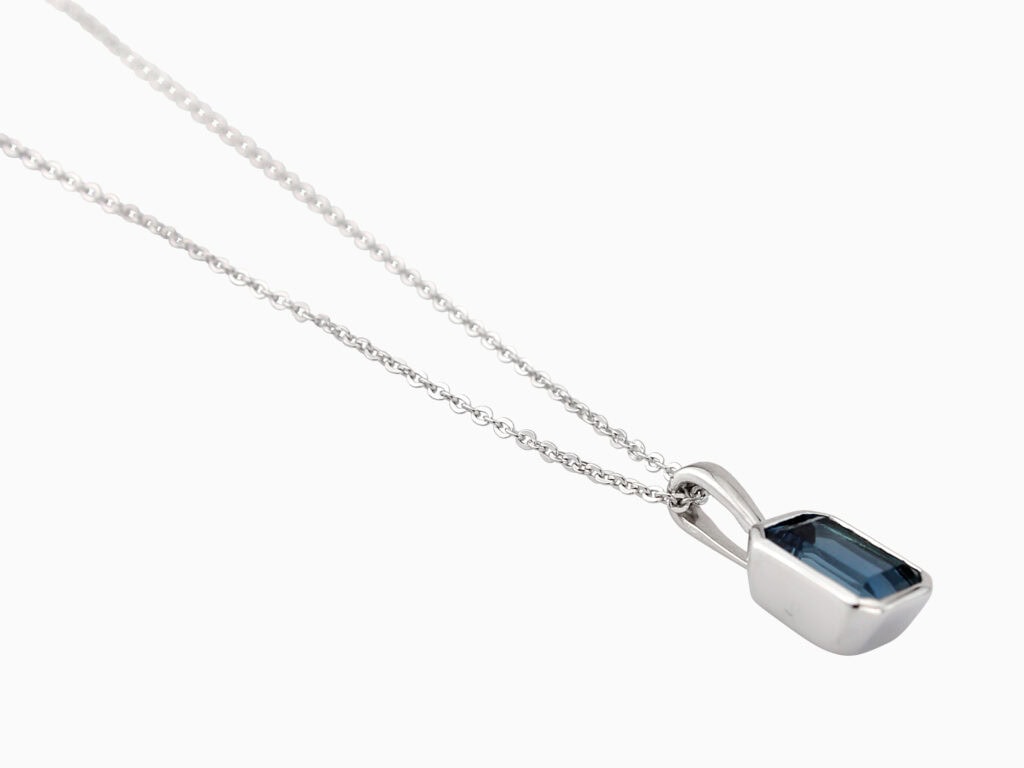 Pendant octagonal LB topaz drop on 9ct white gold chain — side view