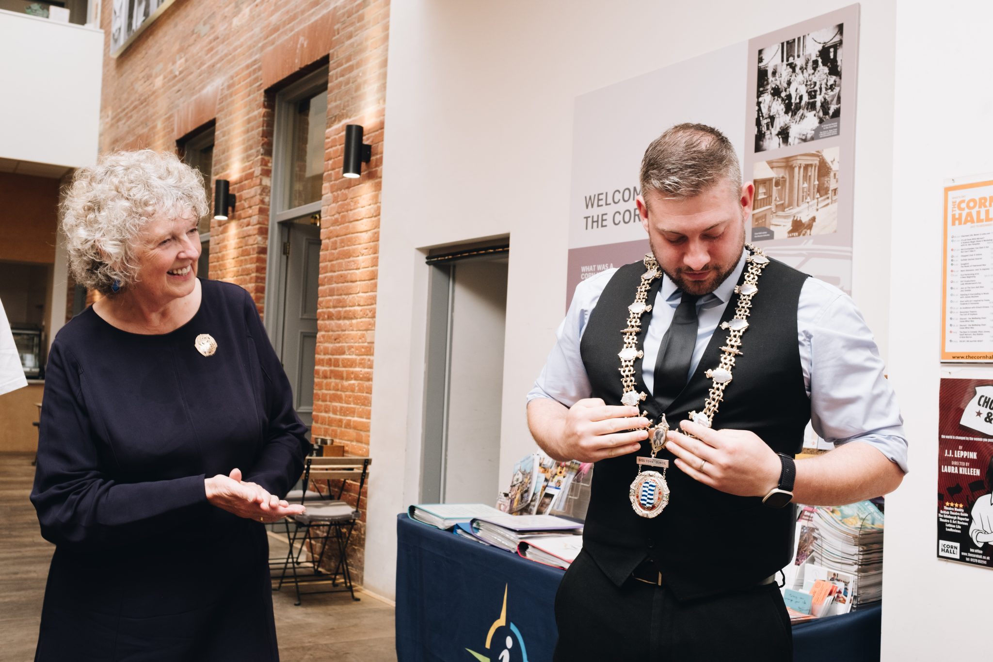 The Mayor of Diss, Declan Craggs, receiving the new mayoral chain insertions at the exhibition opening