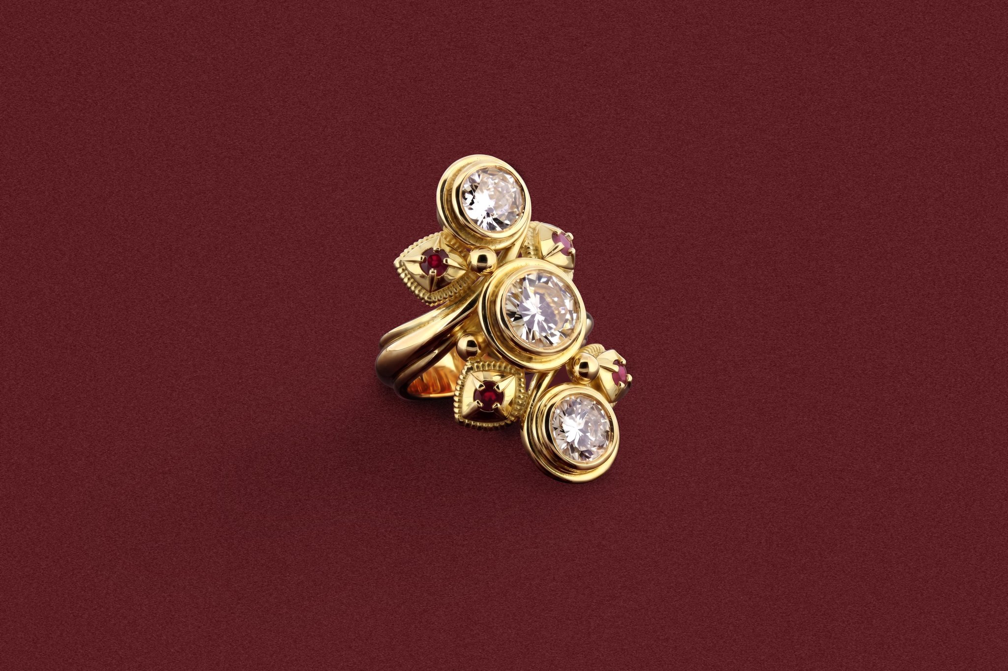 A gold and diamond ring with its stones matched and set by hand at the Diss workshop