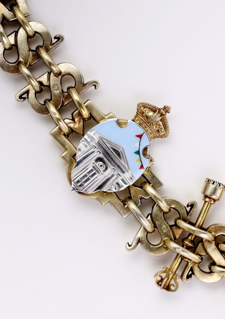 The new mayoral chain insertion depicting The Corn Hall and the town's bunting, designed by Rosie Brown