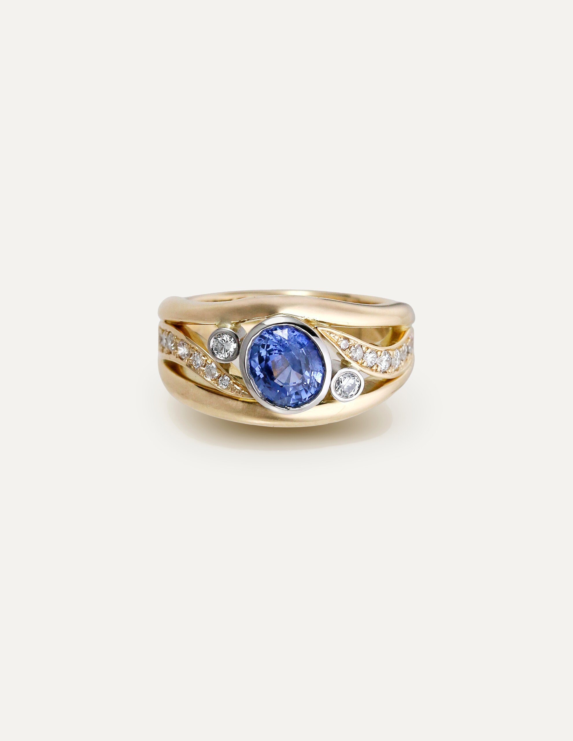One-off 9ct yellow gold ring with a cushion sapphire and diamond-set shoulders