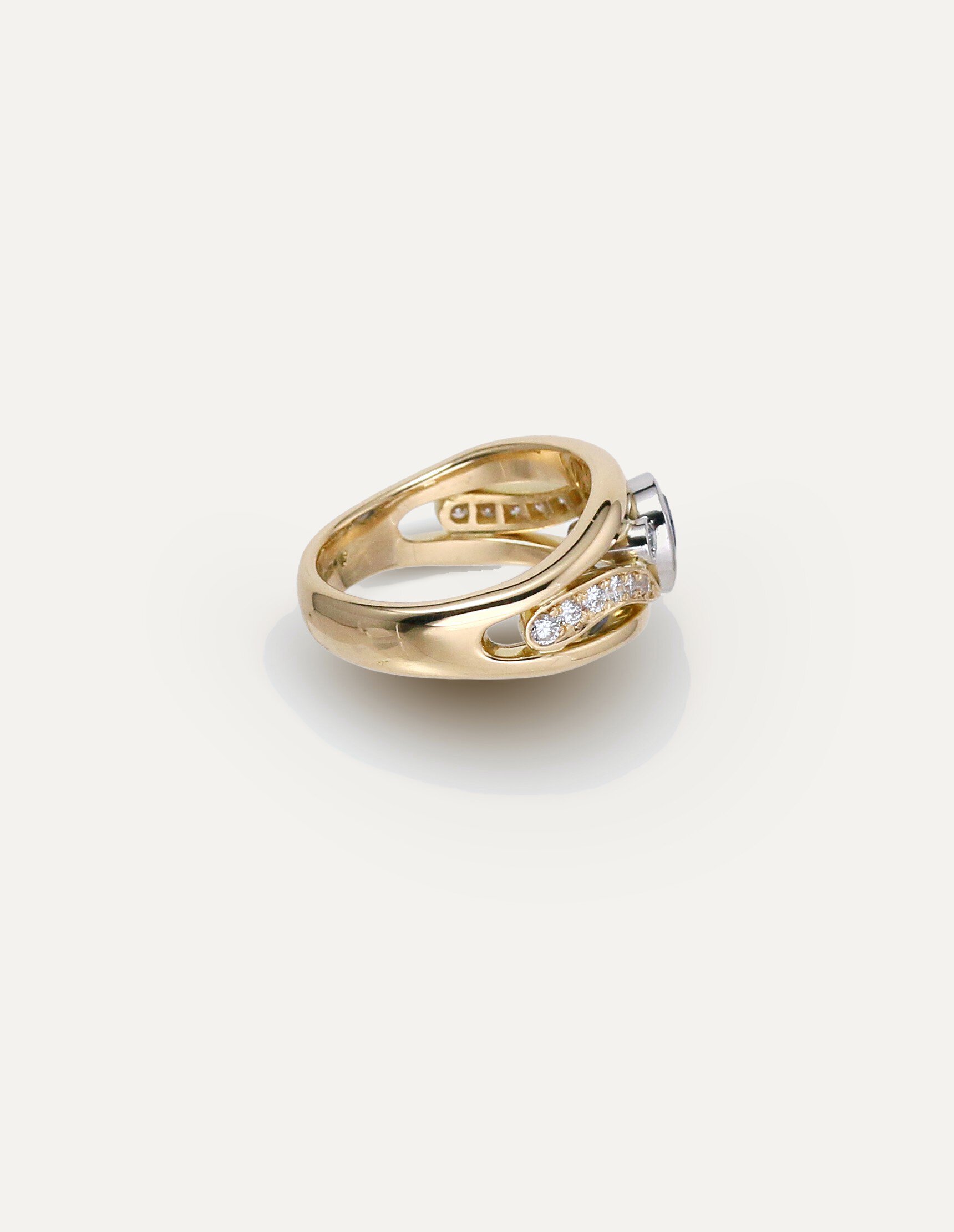 One-off 9ct yellow gold ring with a cushion sapphire and diamond-set shoulders