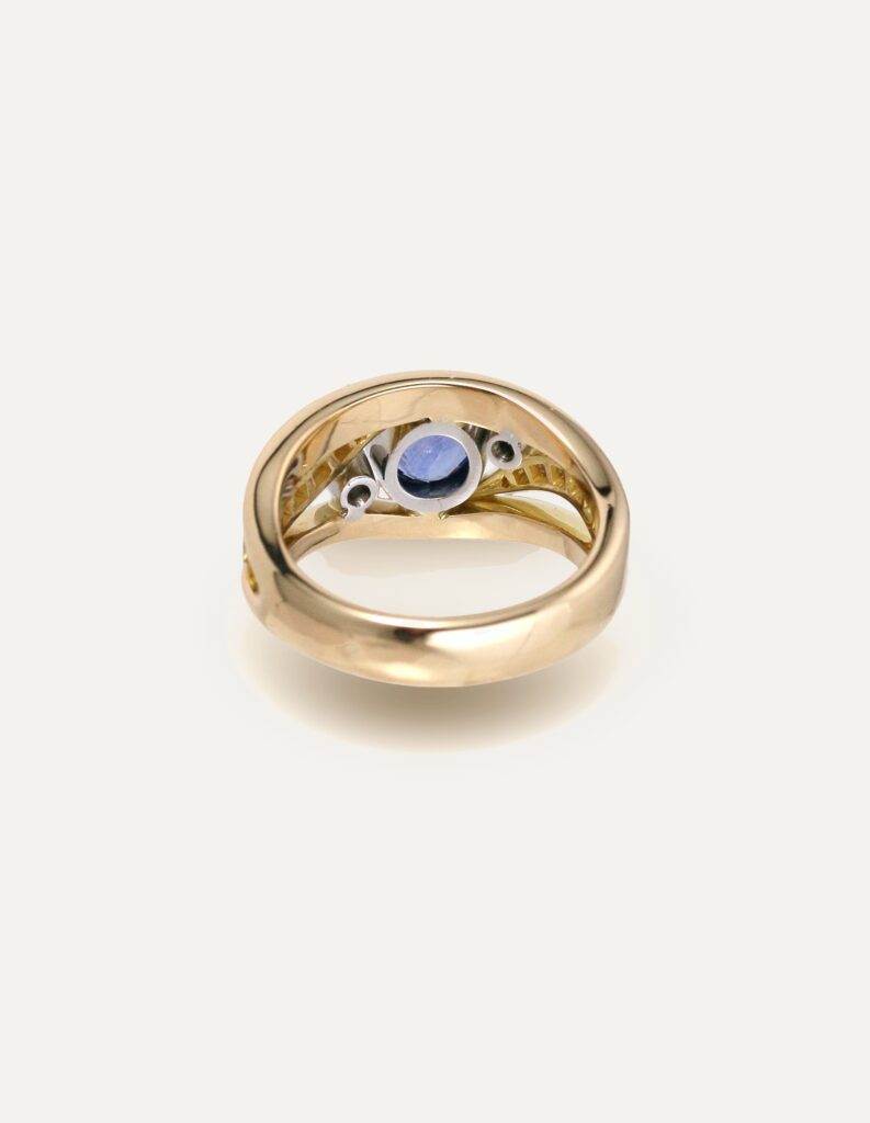 One-off 9ct yellow gold ring with a cushion sapphire and diamond-set shoulders