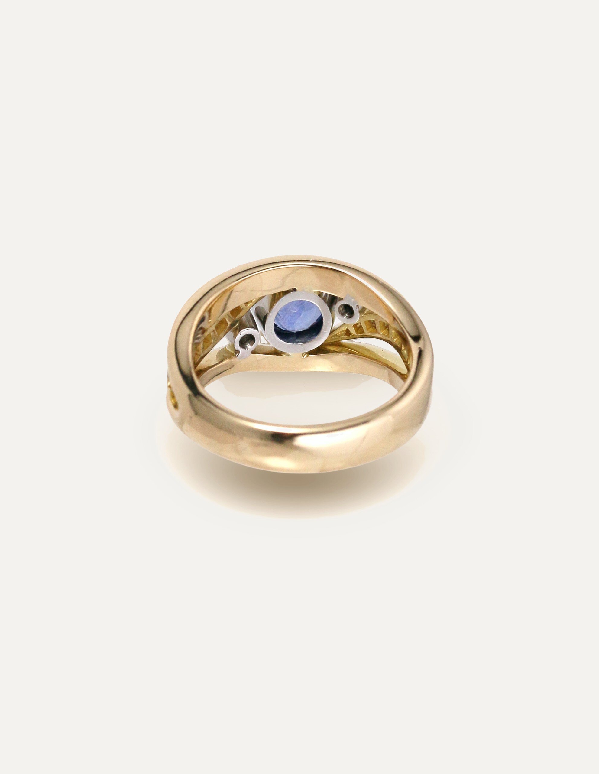One-off 9ct yellow gold ring with a cushion sapphire and diamond-set shoulders