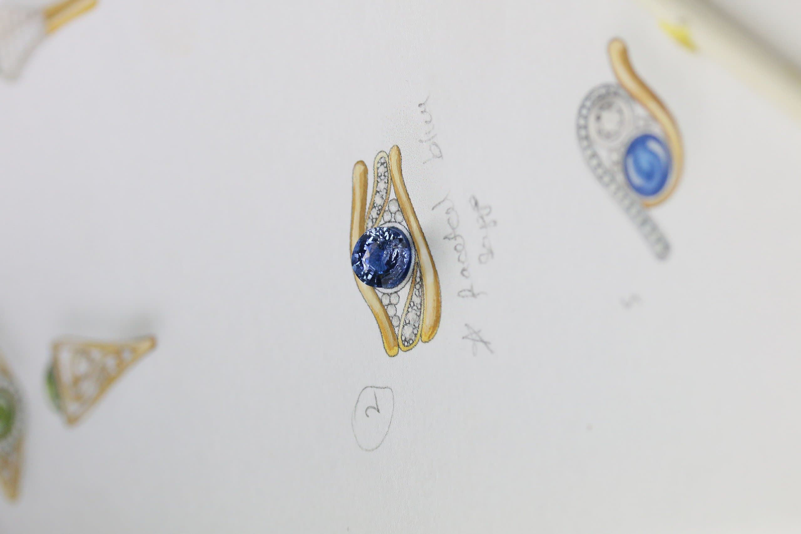 One-off 9ct yellow gold ring with a cushion sapphire and diamond-set shoulders