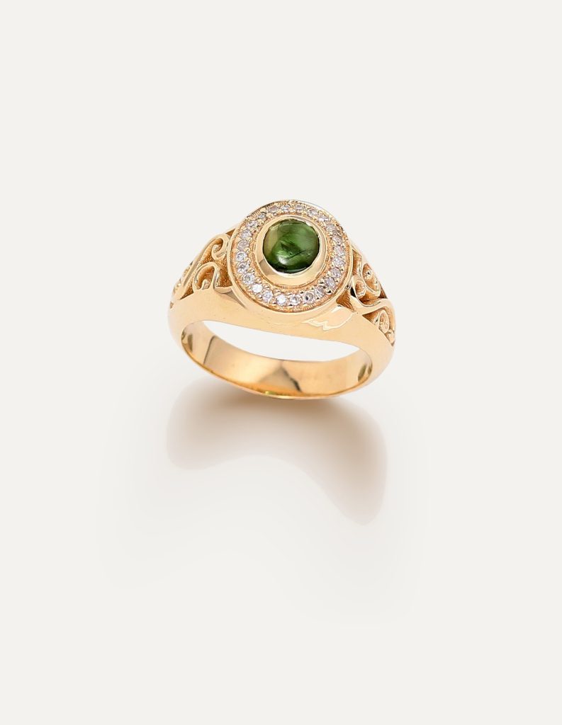 One-off 9ct gold signet ring with a green tourmaline cabochon in a diamond halo