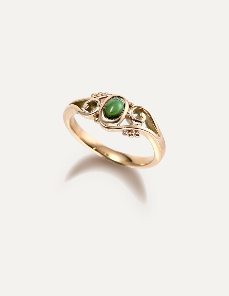 One-off 9ct gold swirl ring with a green tourmaline cabochon and applied gold beads