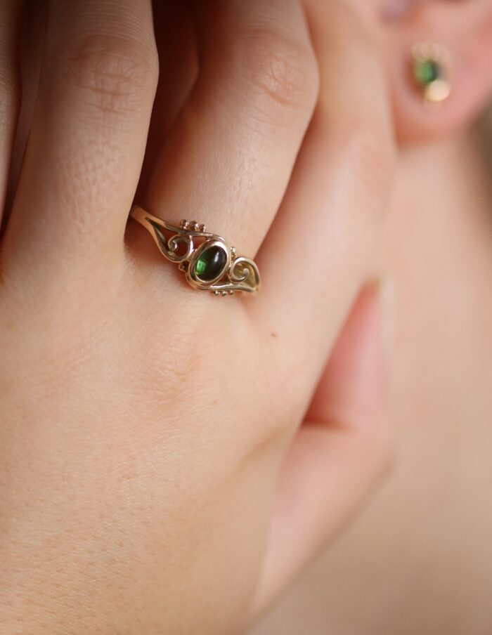 One-off 9ct gold swirl ring with a green tourmaline cabochon and applied gold beads