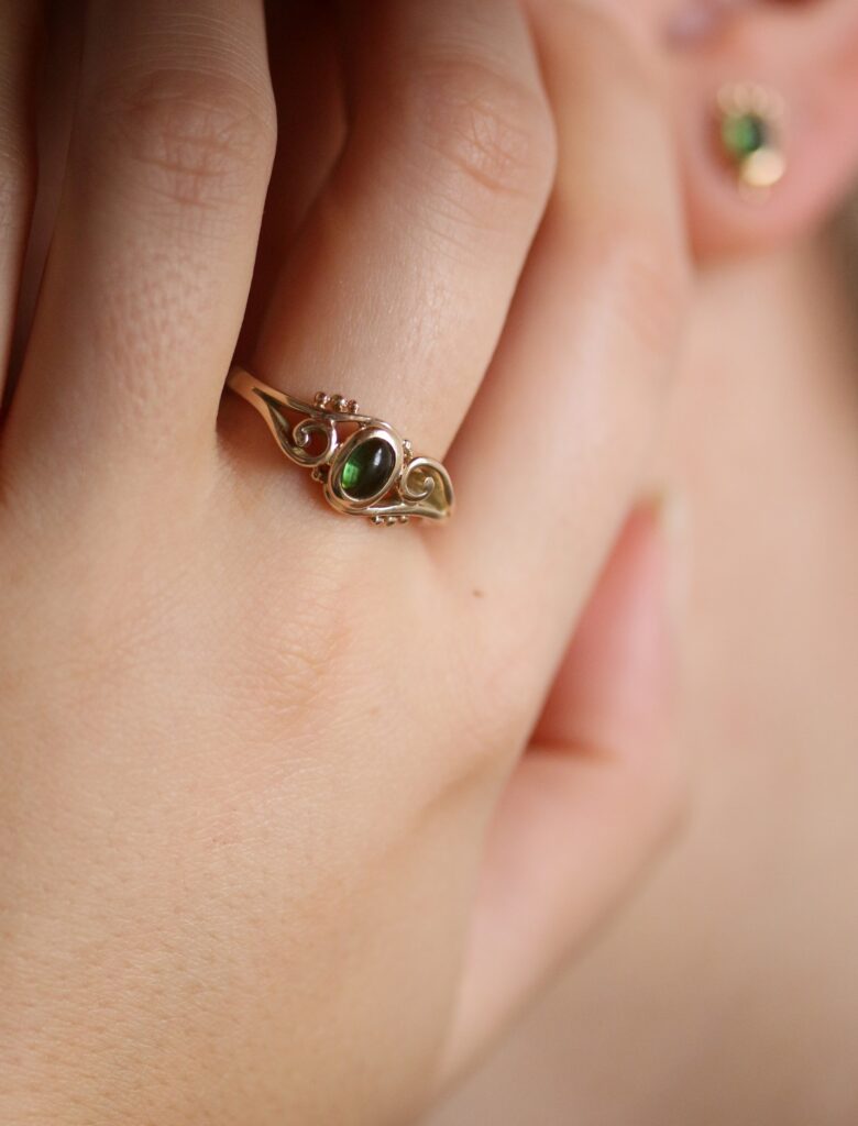 One-off 9ct gold swirl ring with a green tourmaline cabochon and applied gold beads