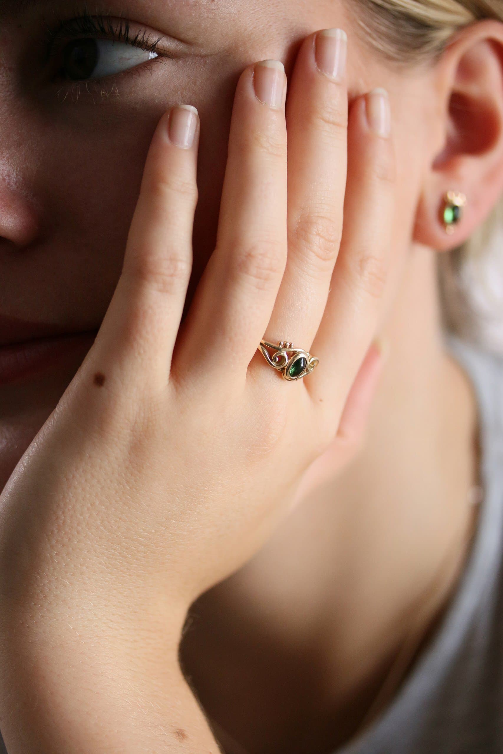 One-off 9ct gold swirl ring with a green tourmaline cabochon and applied gold beads
