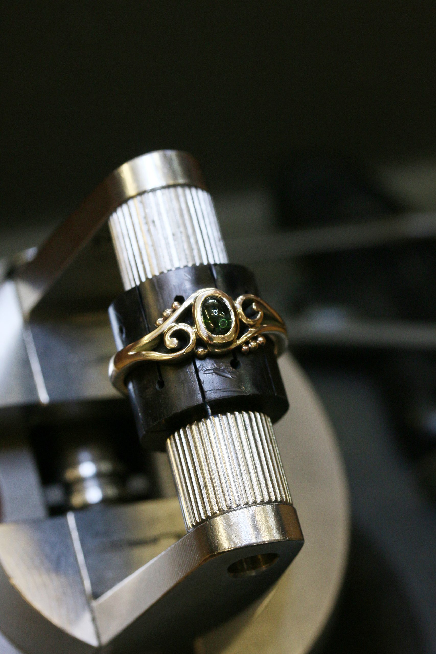 One-off 9ct gold swirl ring with a green tourmaline cabochon and applied gold beads