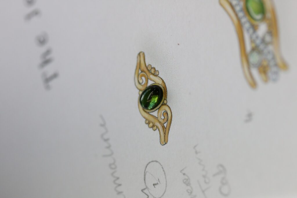 One-off 9ct gold swirl ring with a green tourmaline cabochon and applied gold beads